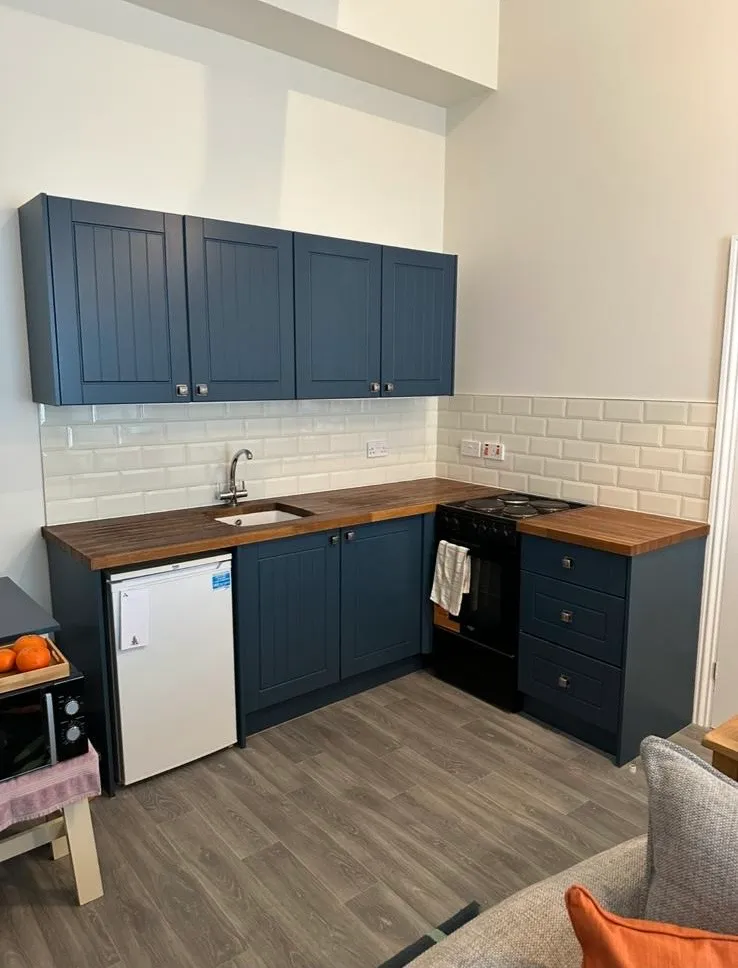 Navy blue hand-painted kitchen cabinets