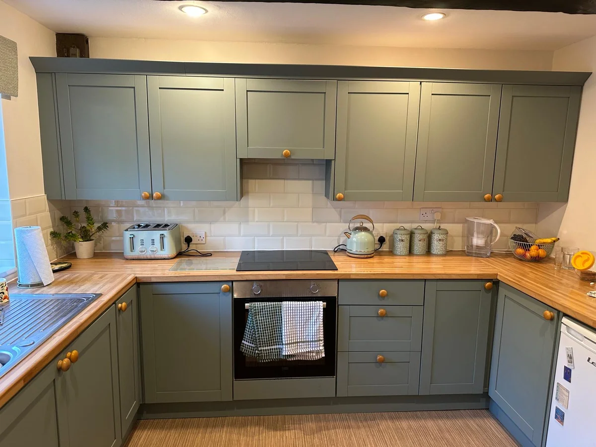 Sage green hand-painted kitchen