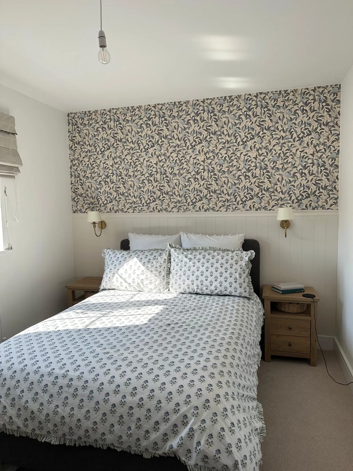 Bedroom with shaker panelling and feature wallpaper